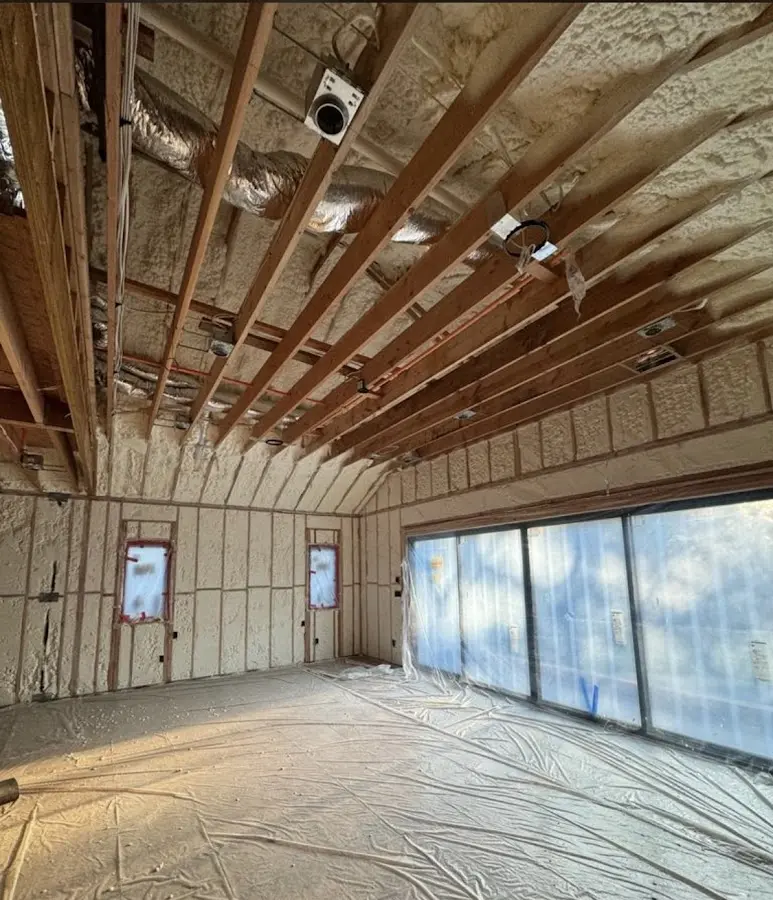 Interior walls and ceiling insulated with spray foam during new construction in Woodbridge